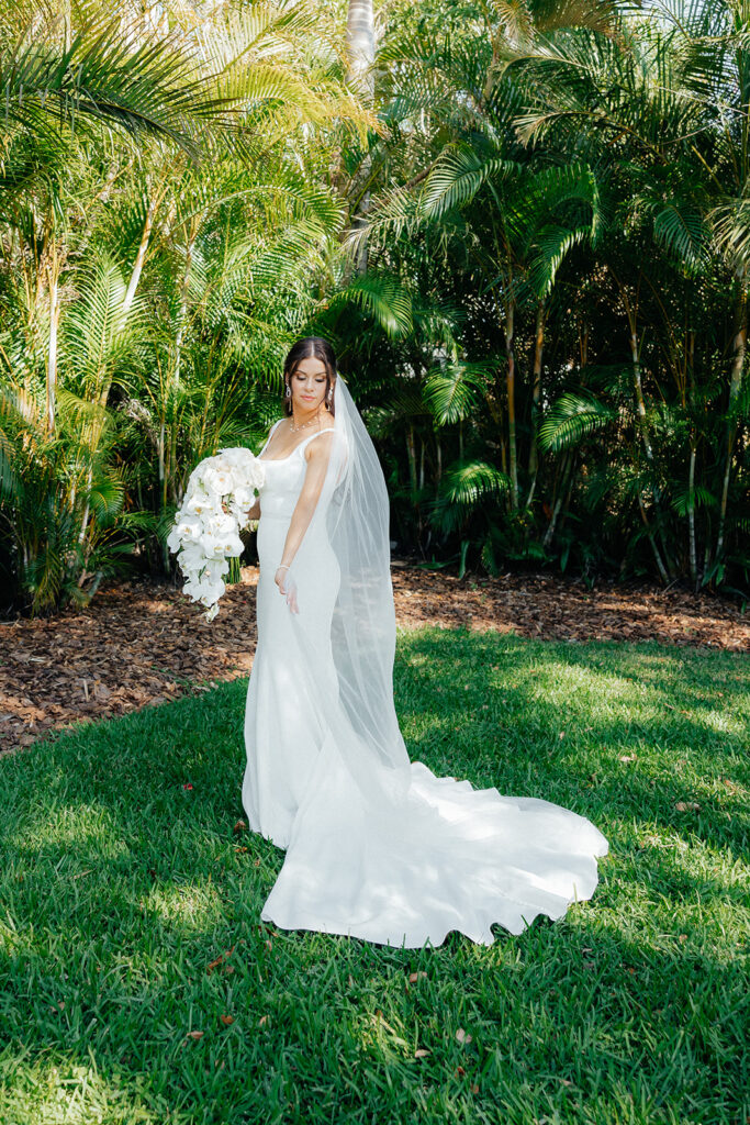 bride wearing white dress and veil