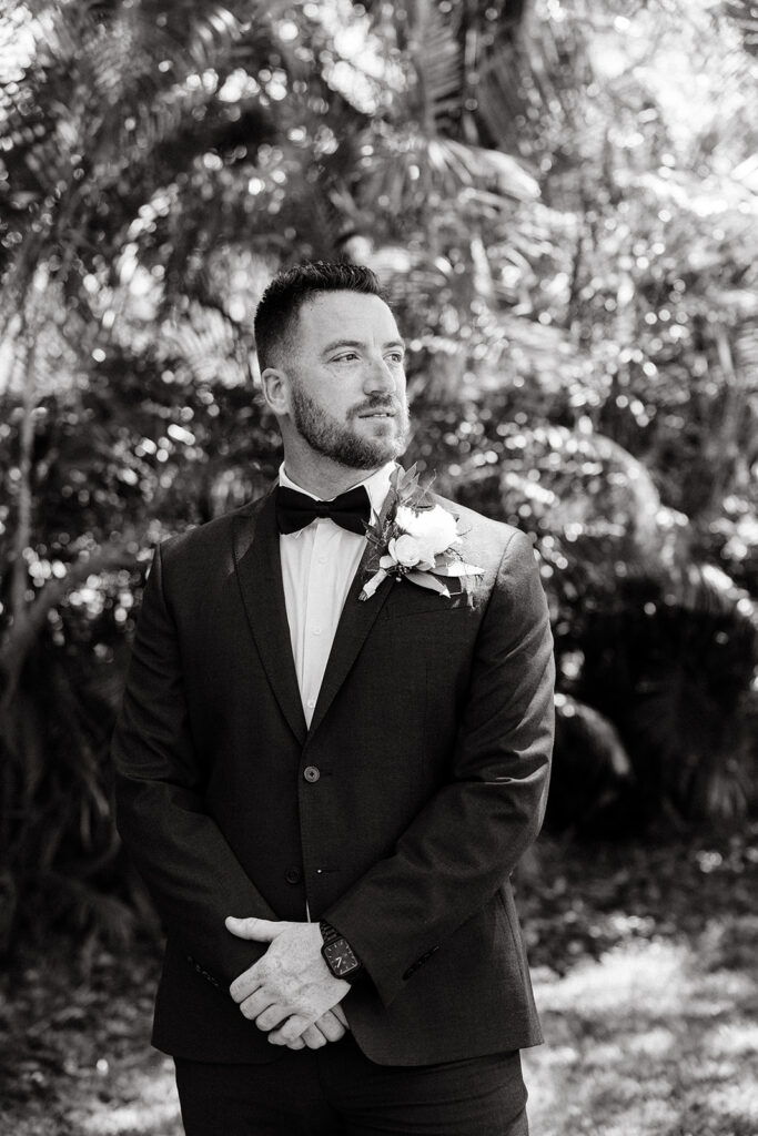 black and white photo of groom at The Alderman House by Mizner