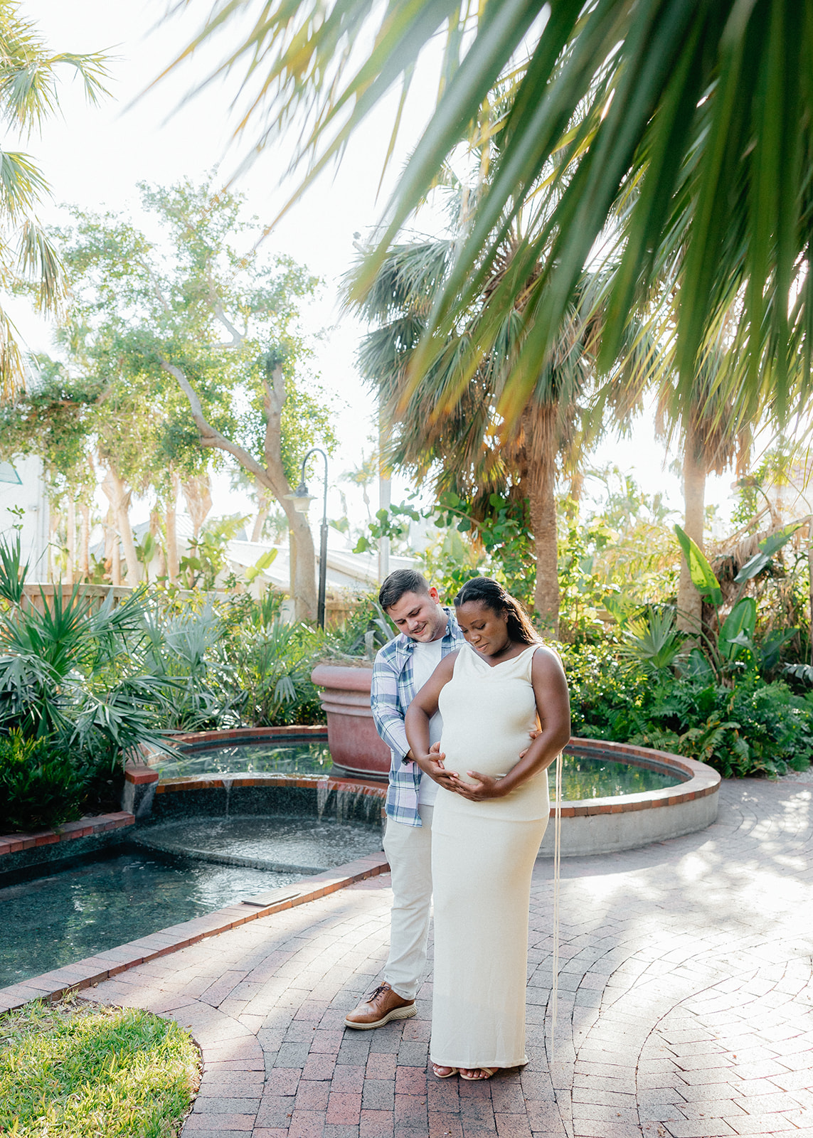 maternity parents posing in Boca Grande Florida
