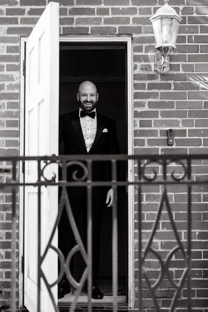 black and white candid photo of groom at Bay Preserve at Osprey wedding