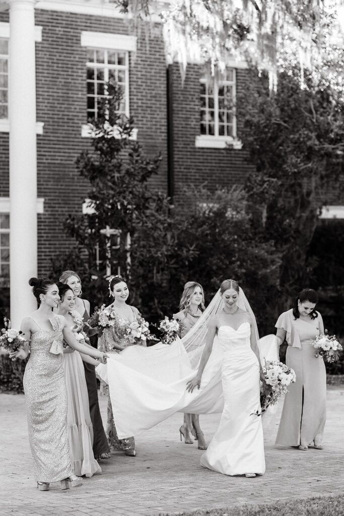 Bride and bridesmaids walking together for Southwest Florida wedding