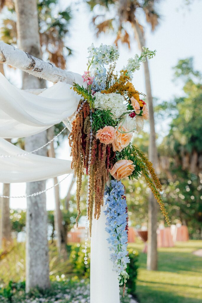 Traditional chuppah with flowers for Jewish wedding at Bay Preserve at Osprey
