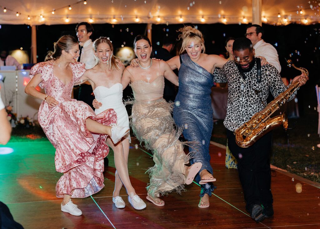 Bride dancing with friends at wedding reception at Bay Preserve at Osprey in Florida