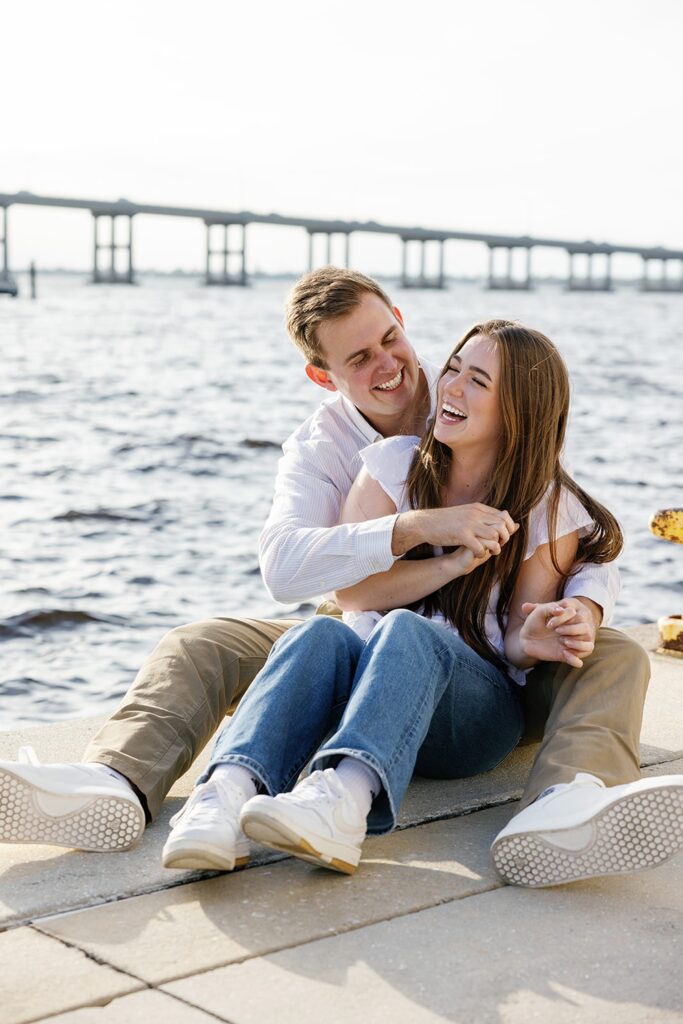 Cute couple laughing during Fort Myers engagement photos