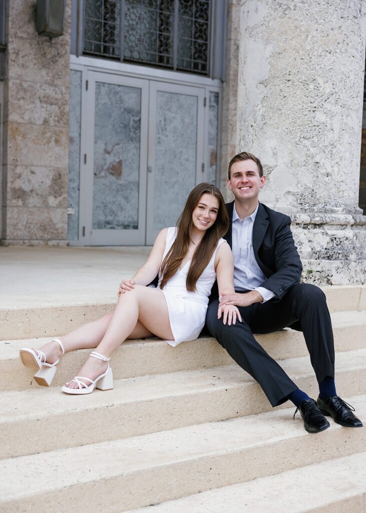Engagement photos on the steps in Downtown Fort Myers