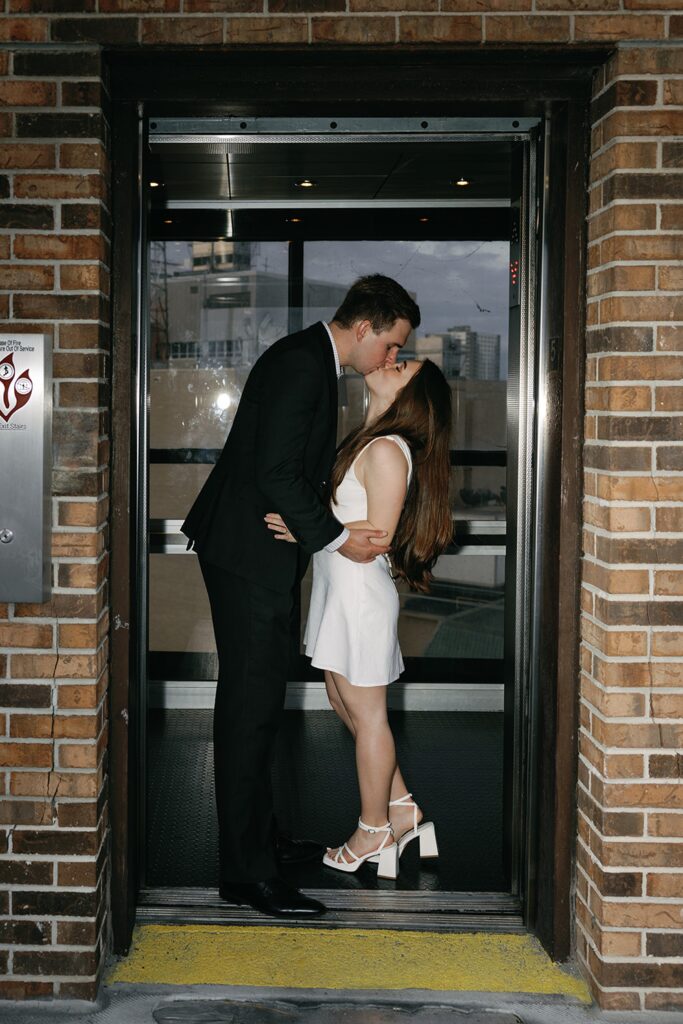 Engagement photos in elevator in downtown Fort Myers